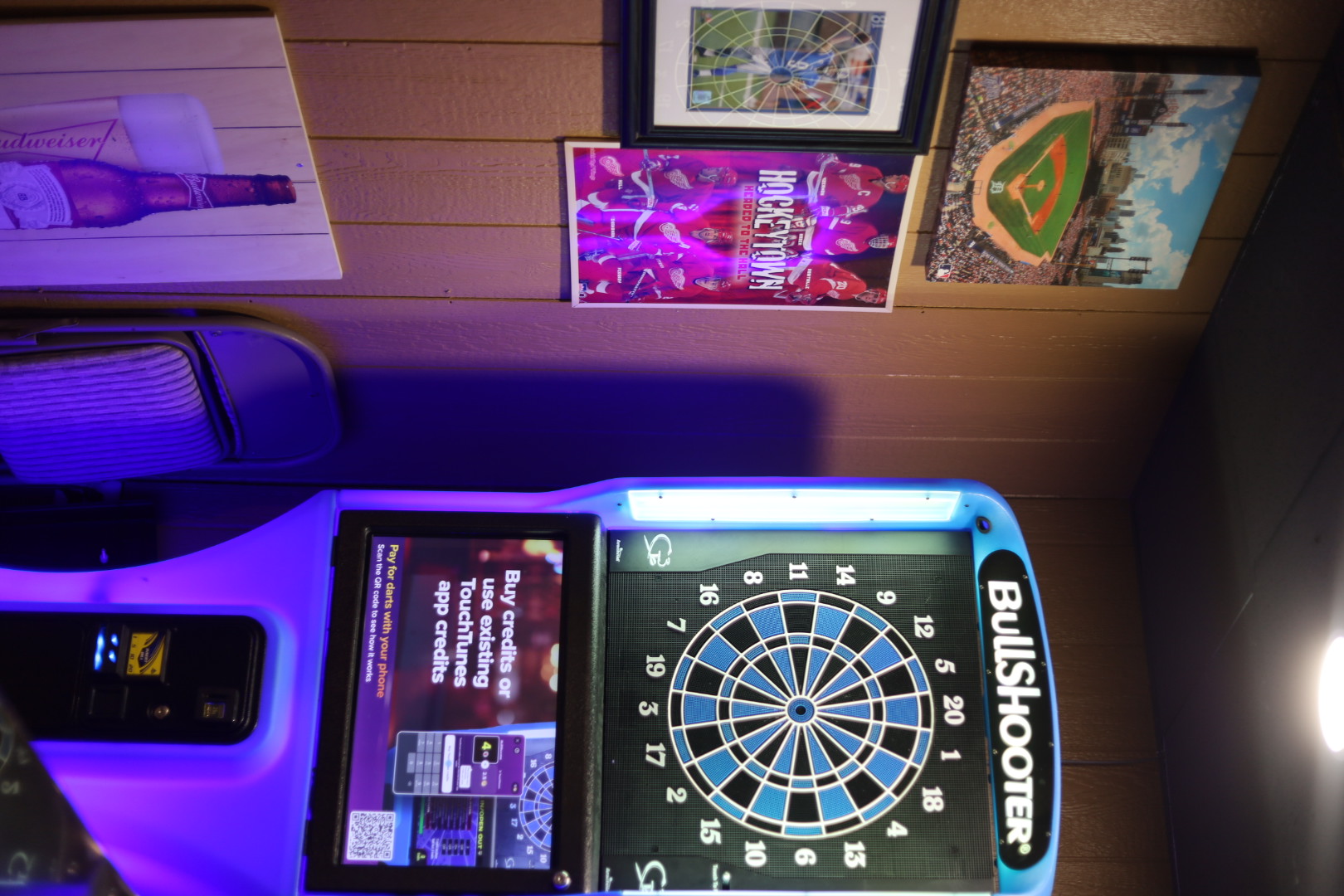 BullShooter dart machine and Detroit sports decor at Shots Bar & Grille